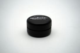 small round black tin